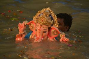Ganesh idol partially submerged