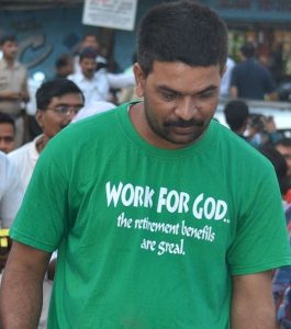 An Indian sports a t-shirt 'Work for God'