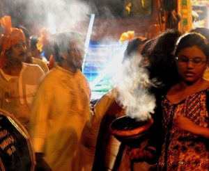 Incense is carried during the ceremony for immersion of Durga
