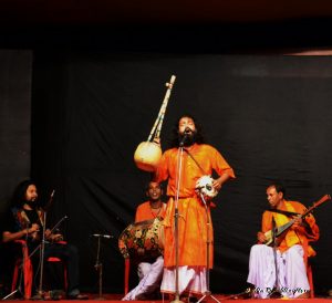 A Baul sings at a Durga Pooja celebration